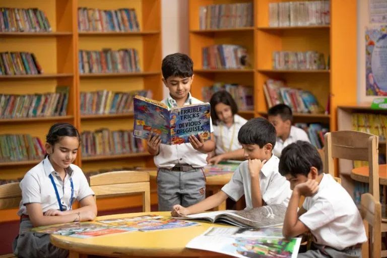 Students reading together in the school library