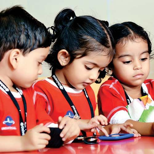 Young learners engaged in early-years activities